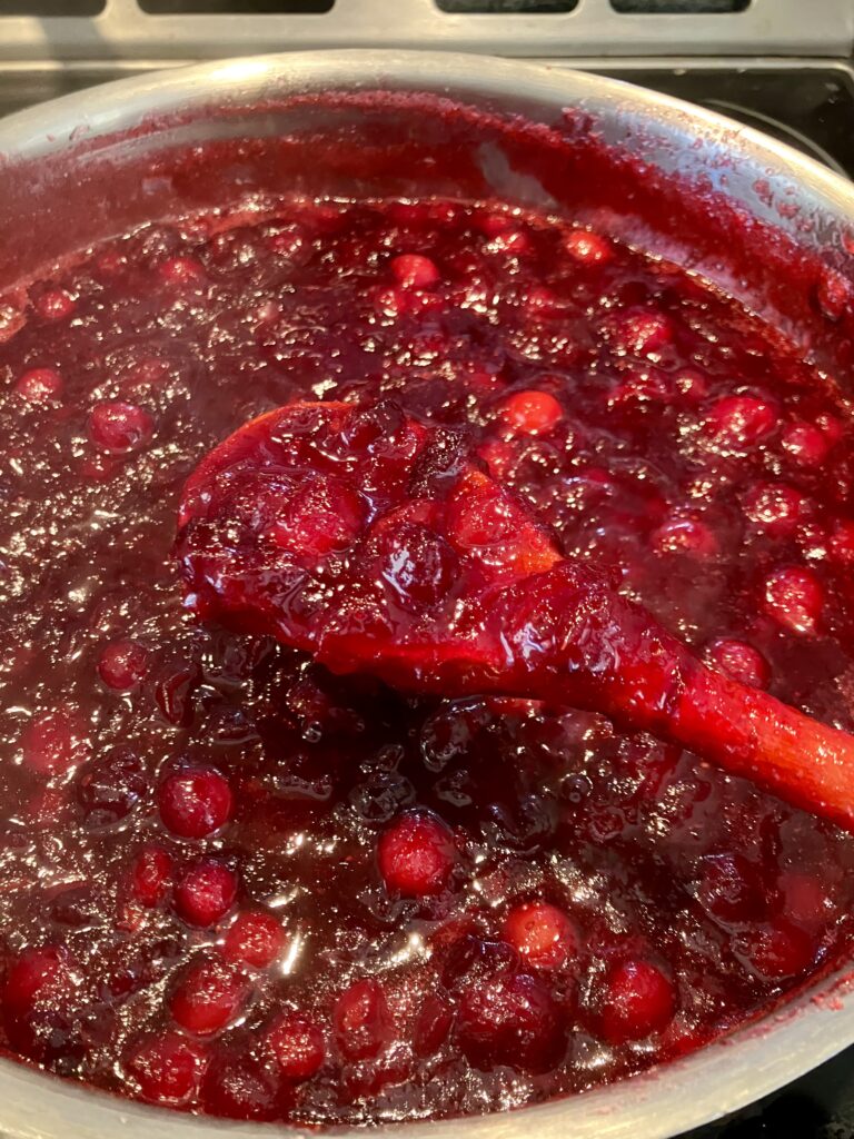 Cranberry sauce that is almost done cooking. 