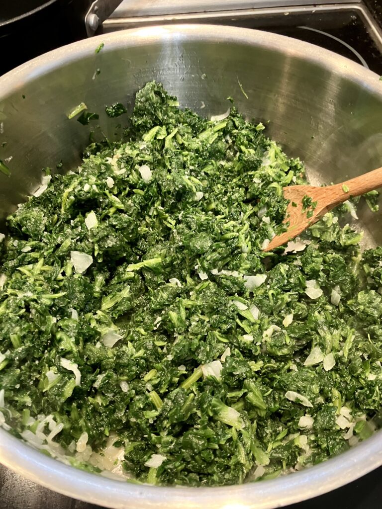 Spinach cooking with onions. 