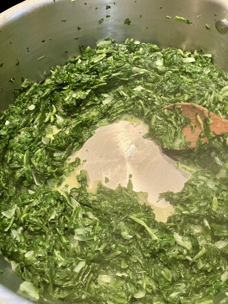 Spinach cooking. Photo demonstrates how the water evaporates after cooking. 