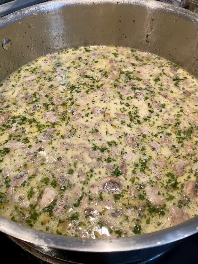 Chicken stock, cream, and sherry added to the mushroom rice. 