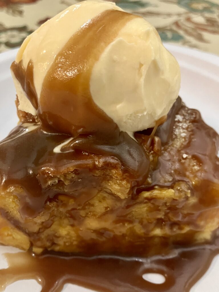 Rum Sauce on Bread Pudding with a scoop of vanilla ice cream. 