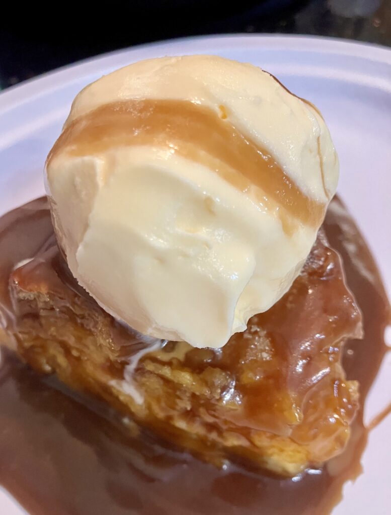 Rum Sauce on Bread Pudding with a scoop of vanilla ice cream. 