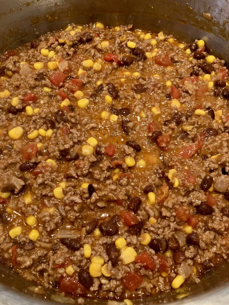 Ground beef, tomato, corn, and black bean sauce. 