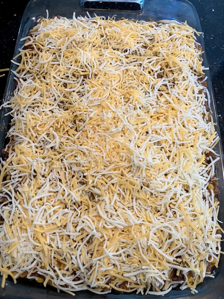 Top layer of shredded cheeses. 